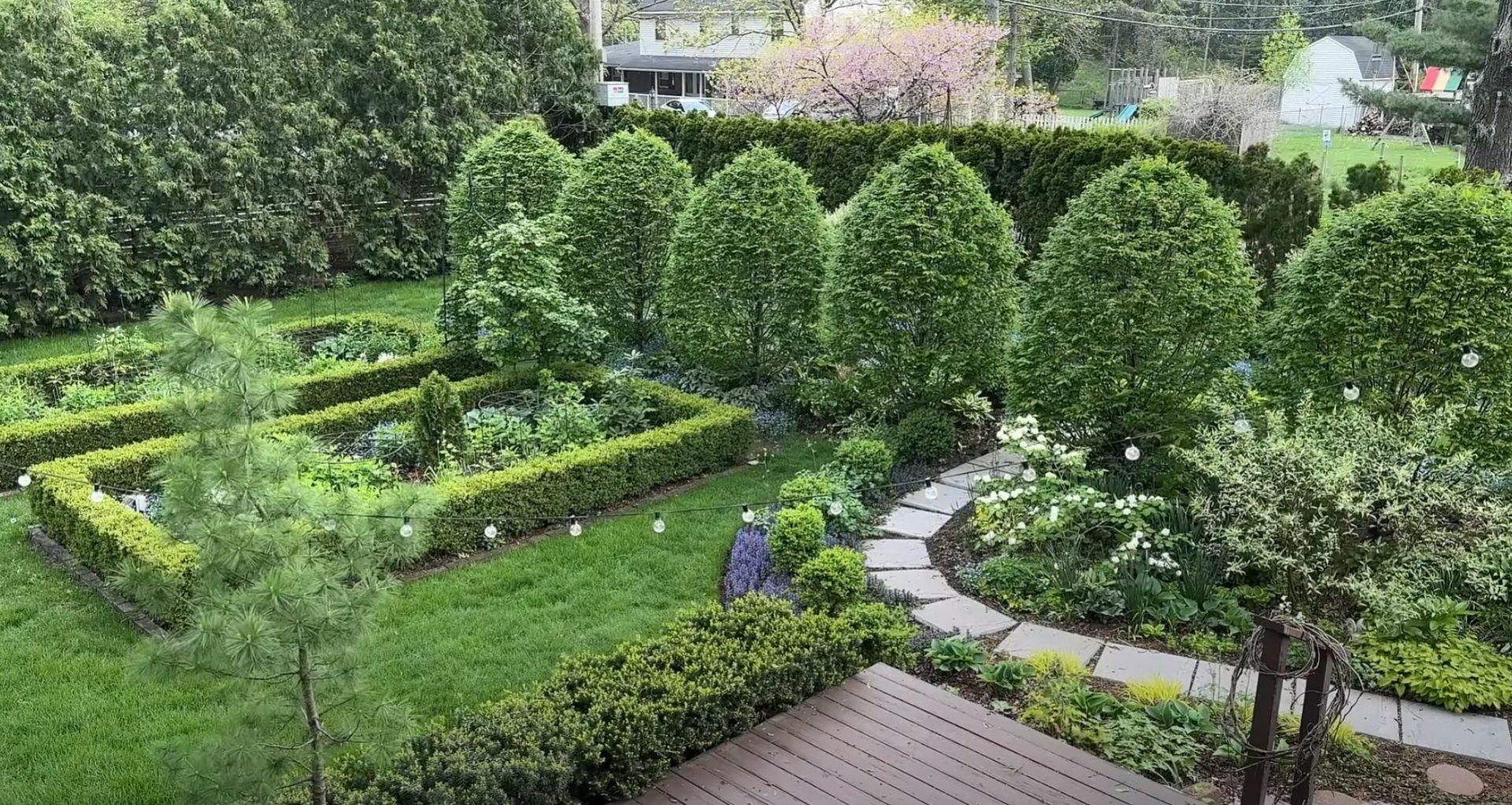 Formal garden design with manicured hedges and pathways