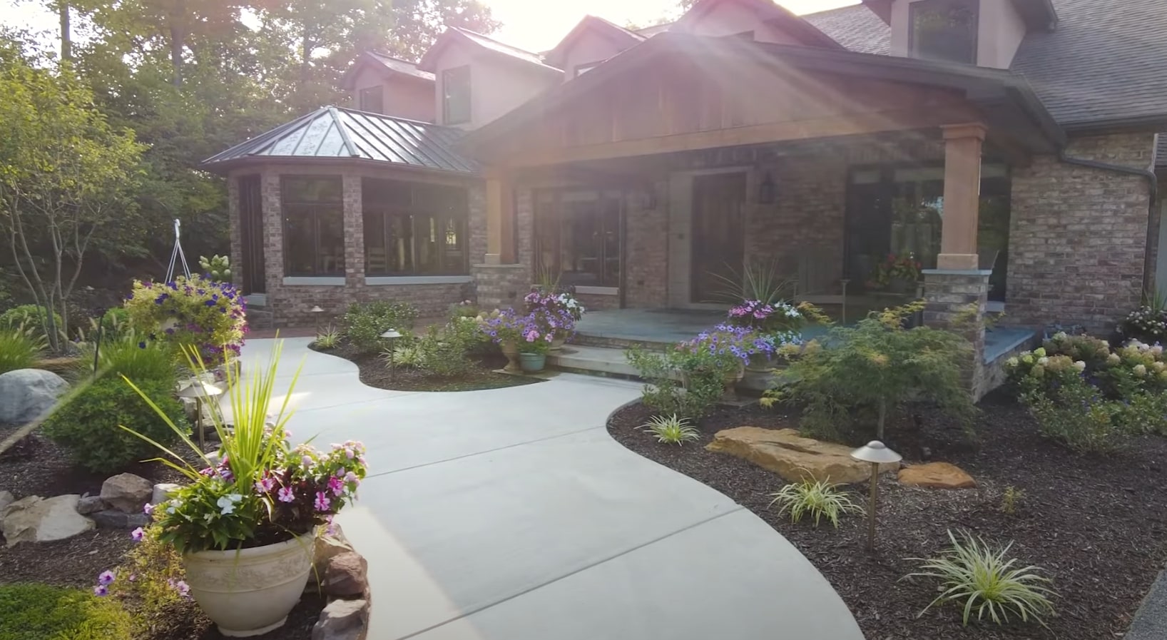 Modern home entrance with sophisticated landscape design featuring native plants and architectural elements